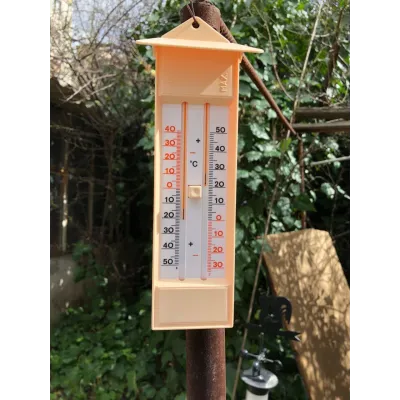 A digital measuring device used to monitor temperature and humidity levels in farm or clinic settings.