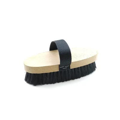 An ergonomic grooming brush with a wooden handle design that offers a more natural and gentler grip experience during horse care procedures.