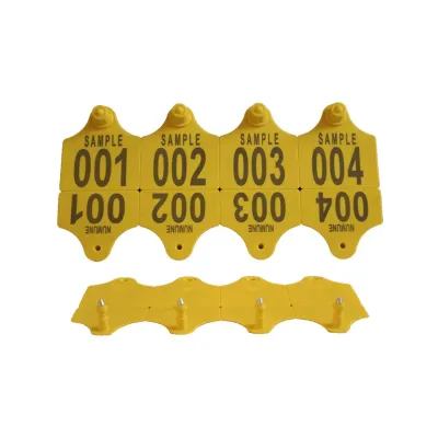 Metal-tipped cattle ear tag with herd tracking number.